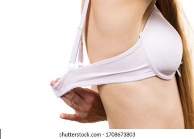 Woman wearing wrong bra, underbust band too wide. Female breast in lingerie. Measure bra size, fitting concept.