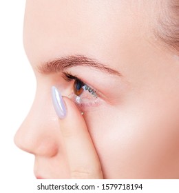 Woman Wears Contact Lenses On Irritated Eyes With Redness. Close-up Shot.