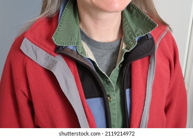 A woman wears many layers of clothing. Layering is a good strategy for frequent temperature changes.