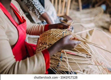 Woman Weaving A Basket Out Of Bamboo In Rwanda Africa