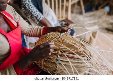 Woman Weaving A Basket Out Of Bamboo In Rwanda Africa