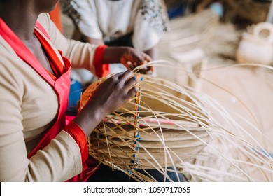 Woman Weaving A Basket In Rwanda, Africa