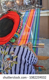 Woman Weaving Many Colors By Hand