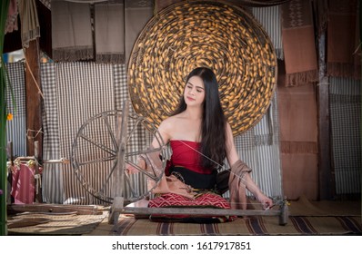 Woman Weaving Thread At Home.