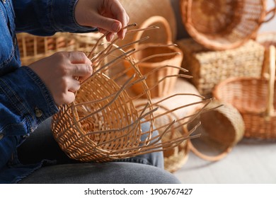 Woman weaving wicker basket indoors, closeup view - Shutterstock ID 1906767427