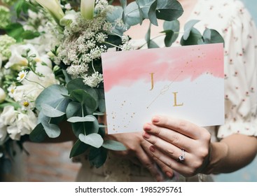 Woman with a wedding invitation card mockup