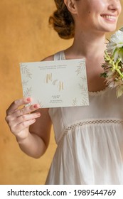 Woman with a wedding invitation card mockup