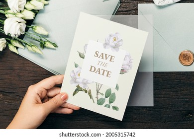 Woman with a wedding invitation card mockup - Shutterstock ID 2005315742