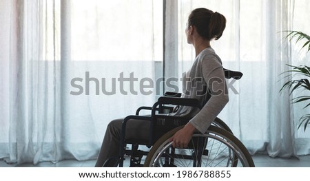 Woman in wheelchair at home alone, disability and loneliness concept