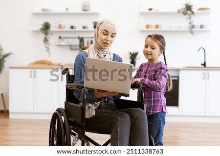 Similar – Image, Stock Photo Joyful wheelchair user with assistant enjoying outdoors