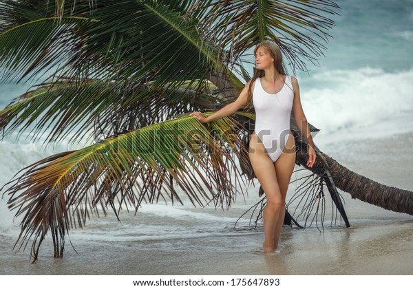 woman-white-bathing-suit-near-palm-stock-photo-edit-now-175647893