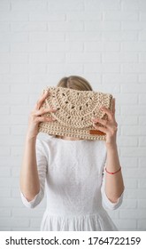 Woman In White Dress Holding Eco Bag Hiding Face Vertical View. 