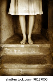 Woman In White Dress On Basement Stairs