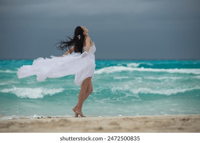 woman in a white dress runs along the beach, runaway bride, brunette in a white dress, girl running - Powered by Shutterstock