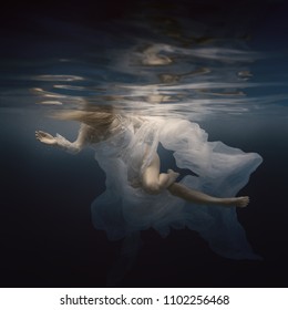 Woman In White Dress Under Water