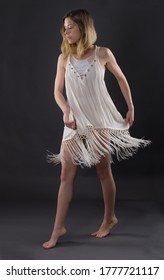 Woman In White Fringe Dress Dancing