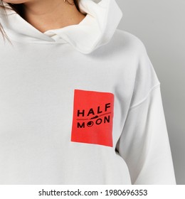 Woman in a white hoodie mockup