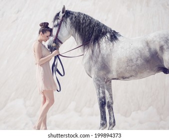 Woman with a white horse 