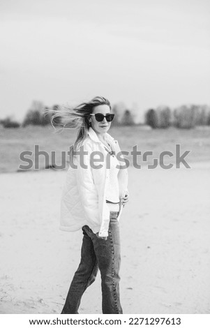 Similar – Portrait von einer jungen Frau mit Wind im Haar