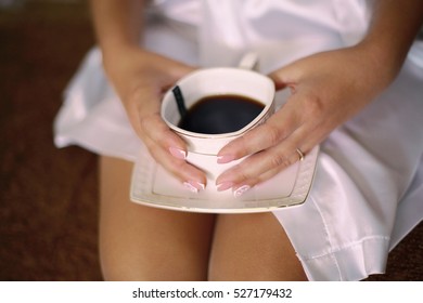 Woman In White Satin Dressing Gown Holding A Cup Of Coffee. Morning Of Bride,