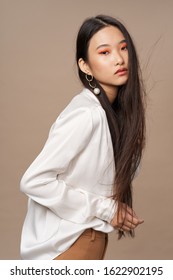 Woman In White Shirt And Dark Hair Asian Appearance Model