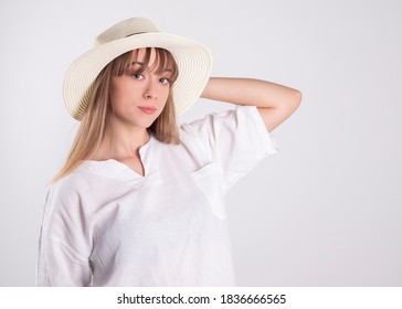 woman in white shirt and hat, on white background - Shutterstock ID 1836666565