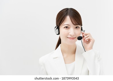 Woman In White Suit Wearing A Headset