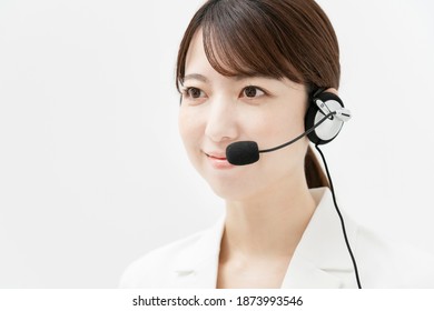 Woman In White Suit Wearing A Headset