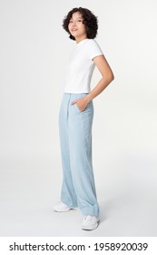 Woman In White Tee And Blue Loose Pants Minimal Fashion