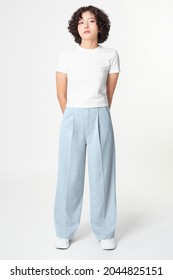 Woman In White Tee And Blue Loose Pants Minimal Fashion