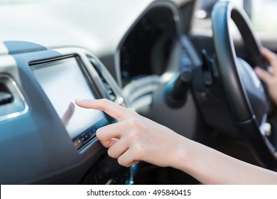 Woman Who Operates A Car Navigation System