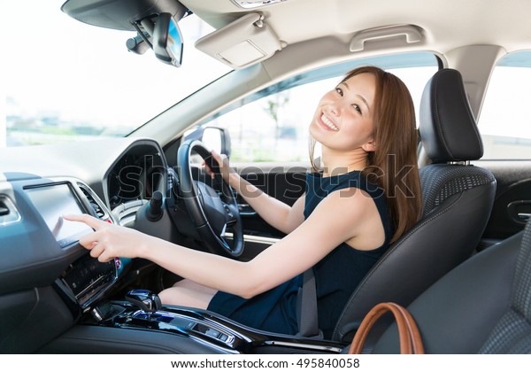 woman who operates a\
car navigation system