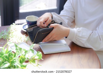 A Woman Who Pays Money From Her Wallet