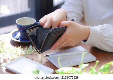 A Woman Who Pays Money From Her Wallet