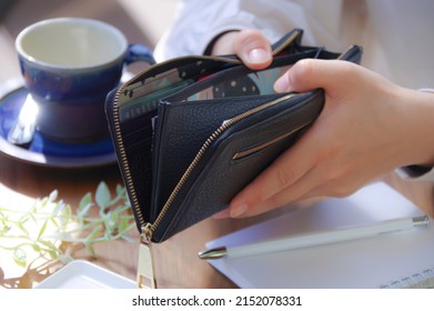 A Woman Who Pays Money From Her Wallet