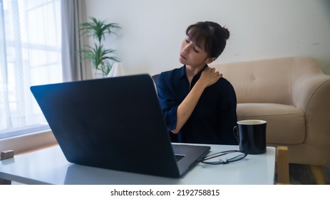 A Woman Who Is Unwell With Stiff Shoulders