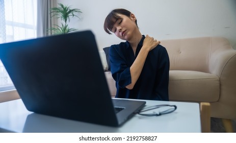 A Woman Who Is Unwell With Stiff Shoulders