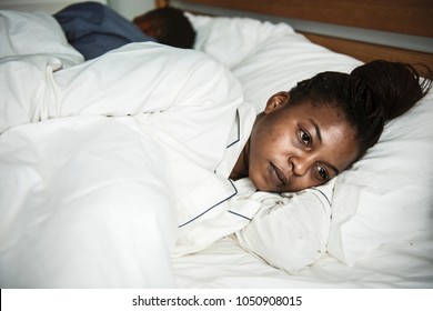 A Woman Wide Awake In Bed