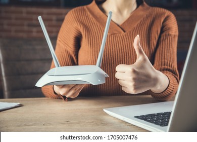 Woman And Wifi Router And Okay Sign