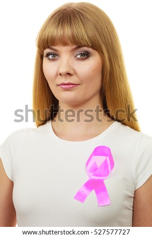 Woman wih pink cancer ribbon on chest. Healthcare, medicine and breast cancer awareness concept. 
