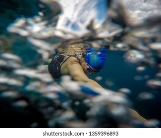 Woman Wild Swimmer No Wetsuit In Almost Abstract Underwater View