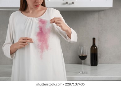 Woman with wine stain on her clothes indoors, closeup. Space for text - Shutterstock ID 2287137435