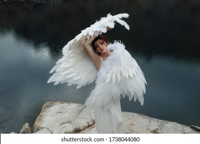 Woman with wings in the image of an angel. Angel dance