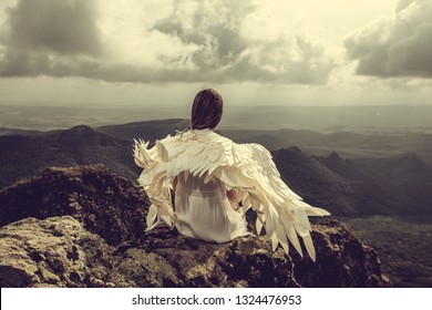 Woman Wings Sitting On Rock Looking Stock Photo (Edit Now) 1324476935