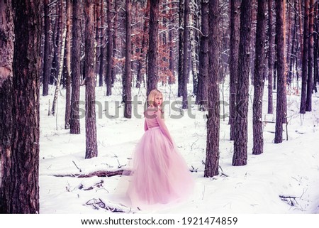 Woman in a winter forest with snow