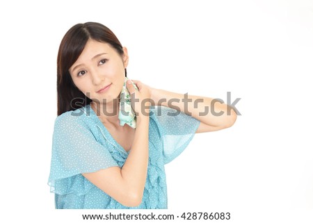 Woman wiping off the sweat