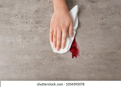 Woman Wiping Table With Paper Towel