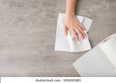 Woman Wiping Table With Paper Towel