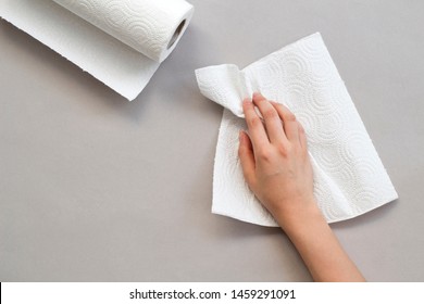 Woman Wiping Table With Paper Towel