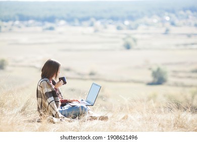 Woman Woking Outdoors. Remote Work On Camping. Female Typing On Pc.